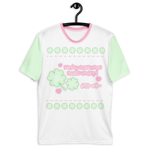 A white t-shirt with green short sleeves and a clover graphic on the front, featuring japanese text and the words "make someone smile today".