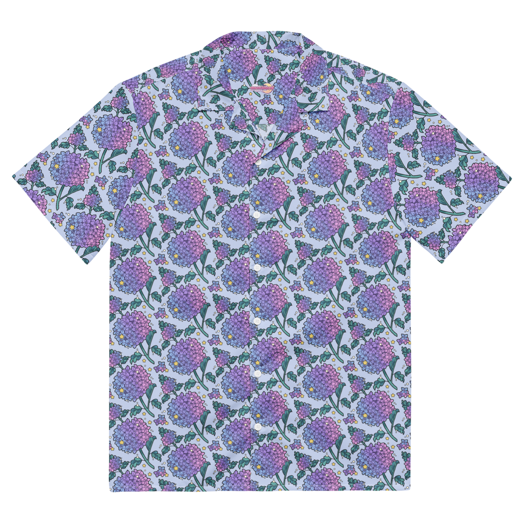 A blue button up shirt with a floral hydrangea pattern on it.