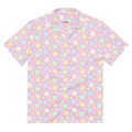 A pink button up shirt with a pastel rainbow star pattern on it.