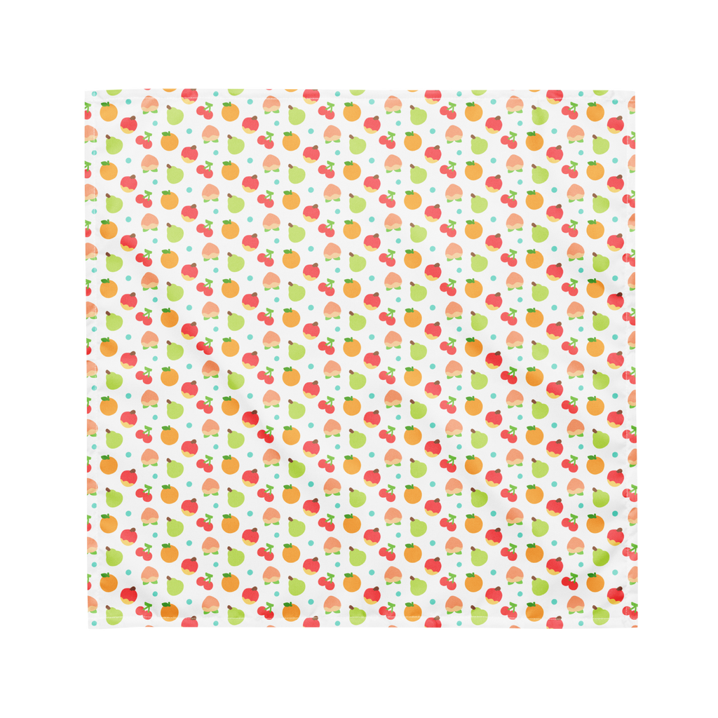 A white bandana lying flat with a colorful fruit pattern on it.