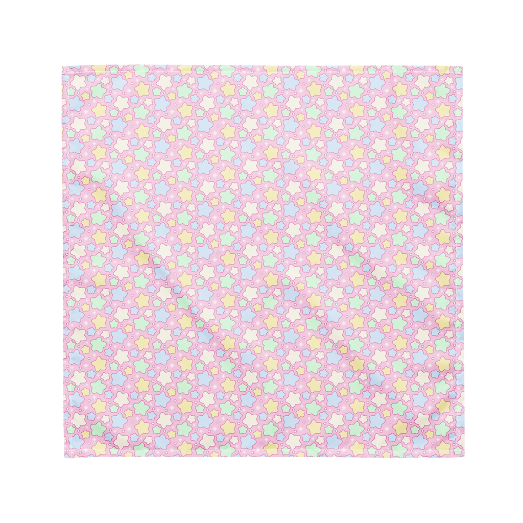 A pink bandana lying flat with a pastel rainbow star pattern on it.