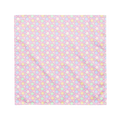 A pink bandana lying flat with a pastel rainbow star pattern on it.