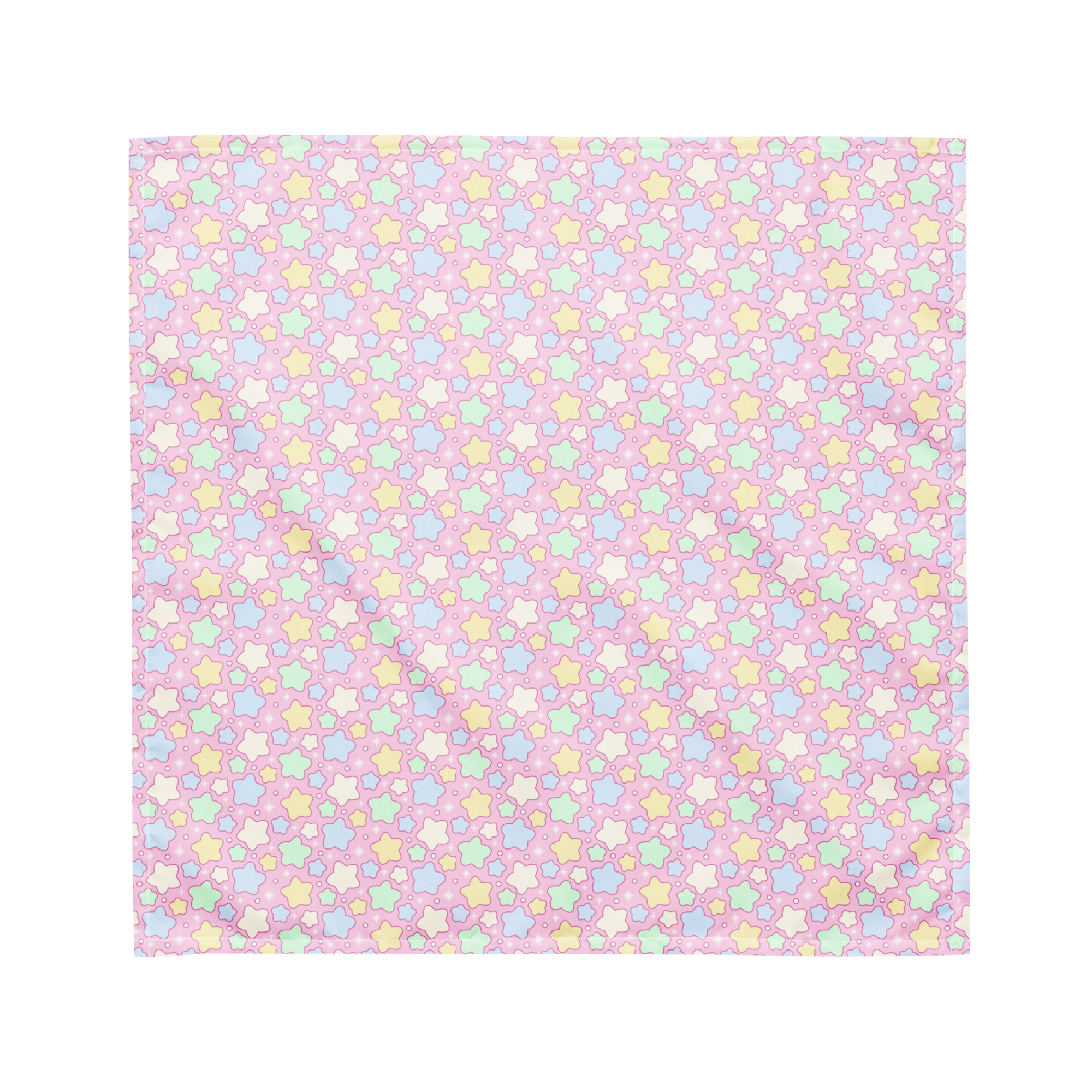 A pink bandana lying flat with a pastel rainbow star pattern on it.