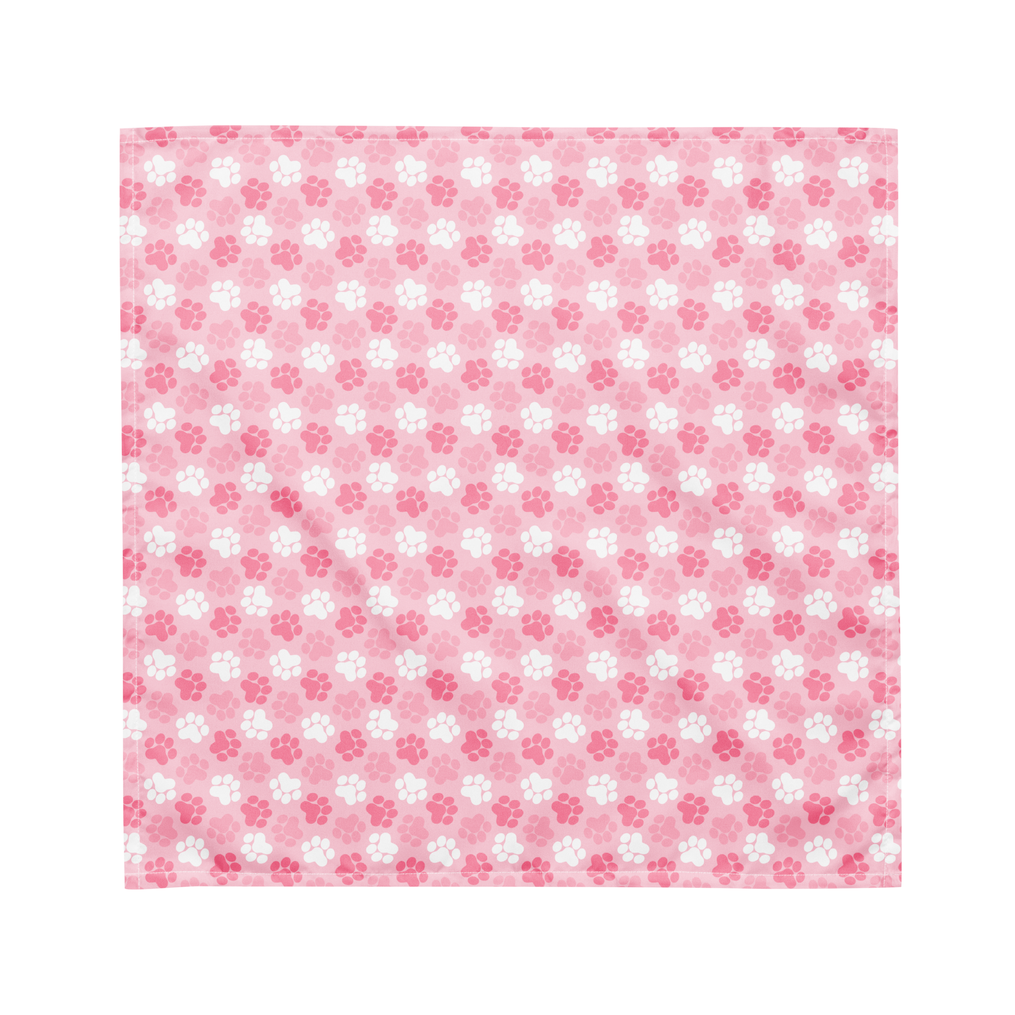 A cute pink bandana lying flat with a pink and white paw print pattern on it.