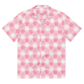 A cute pink button up shirt with a pink and white paw print pattern.