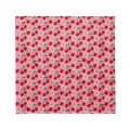 A cute pink bandana lying flat with a cherry and floral pattern on it. 