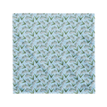 A blue bandana lying flat with a floral lily of the valley pattern on it.