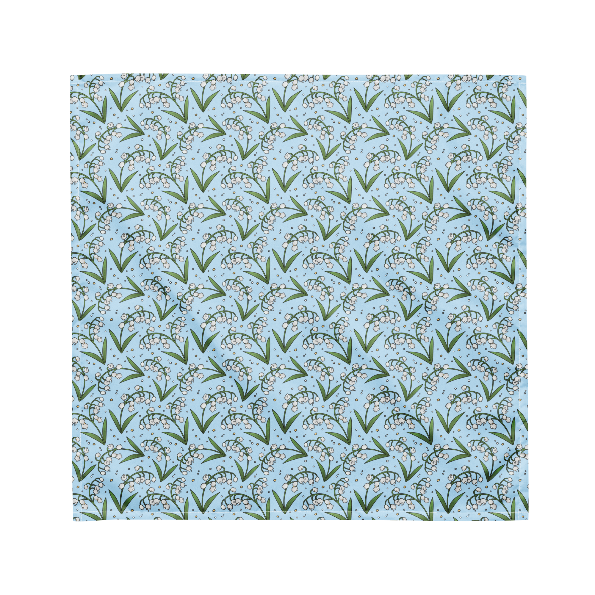 A blue bandana lying flat with a floral lily of the valley pattern on it.